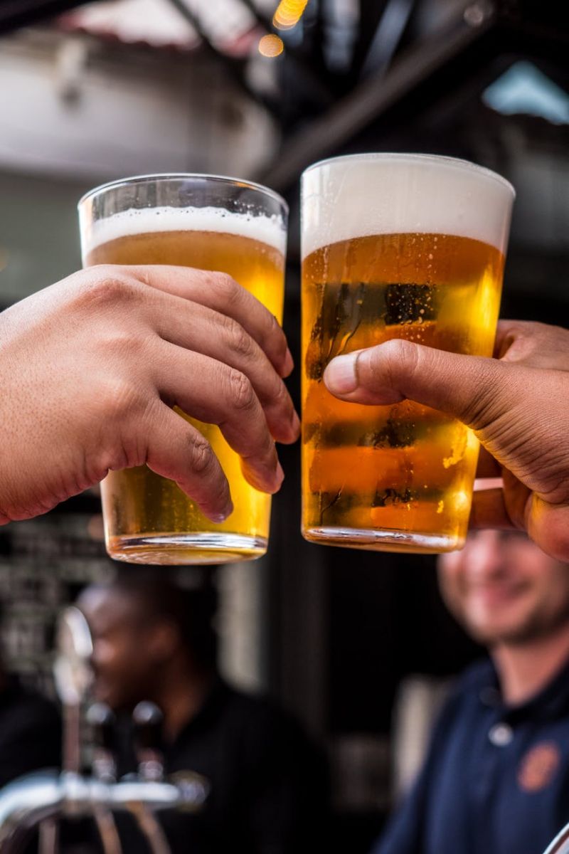 Two Pint glasses with a celebratory Cheers! 